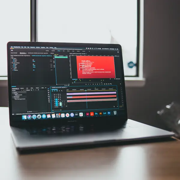 Laptop running a development environment on a desk